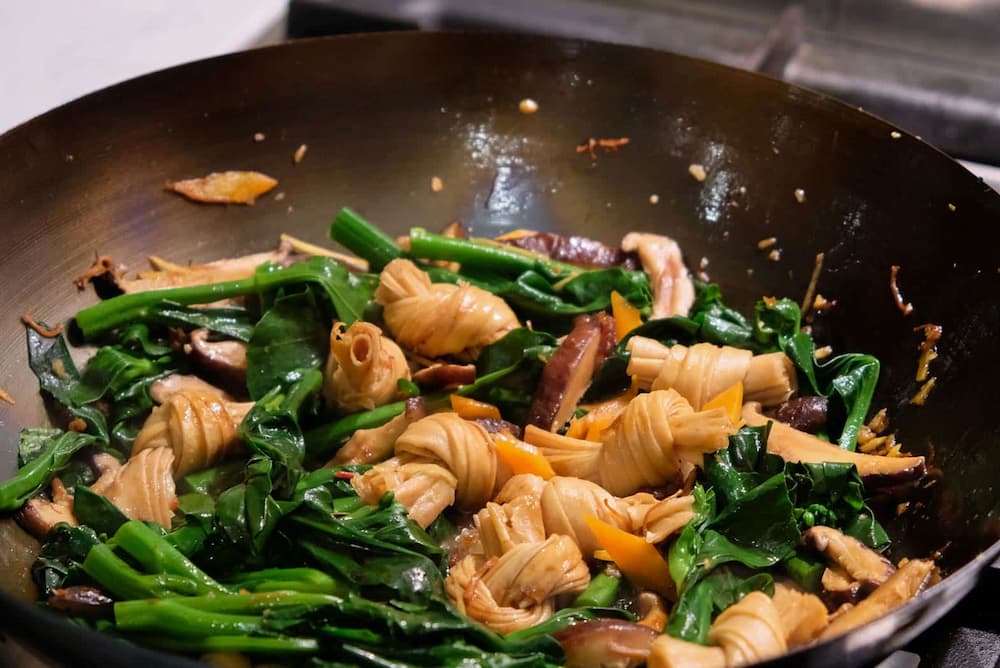 Fried Chinese broccoli, dried shitake mushrooms and dried beancurd knots with XO sauce