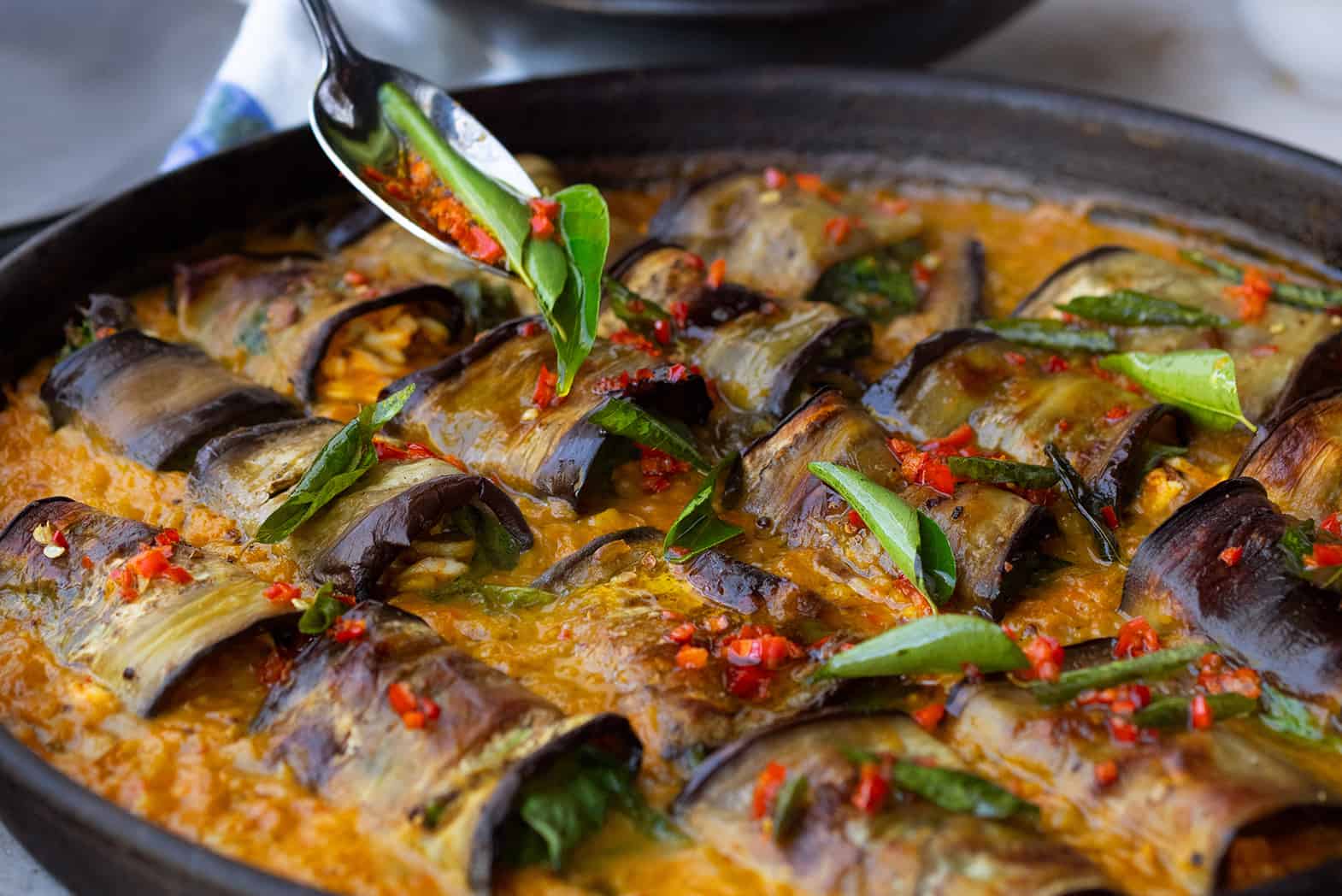 Stuffed Aubergine In Curry And Coconut Dal
