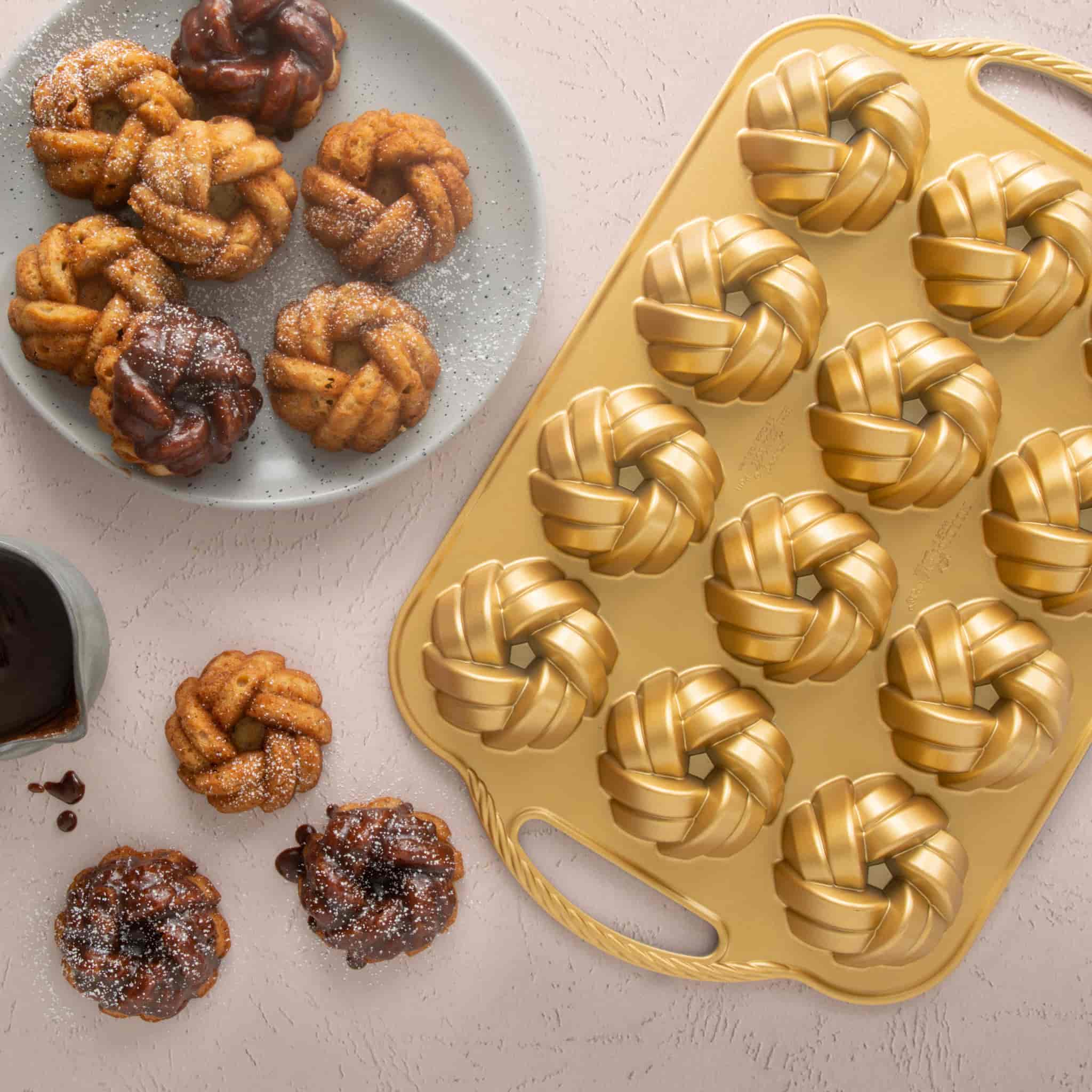 NordicWare Gold Braided Mini Bundt Pan with cakes