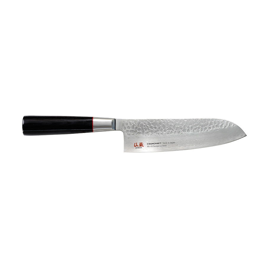 A Japanese santoku knife with a damascus-patterned blade and a dark handle.